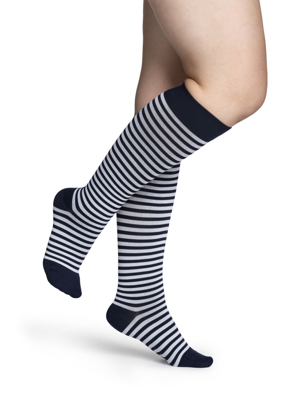 Female wearing WELLBEING MICROFIBER SHADES compression socks in MARINER STRIPE